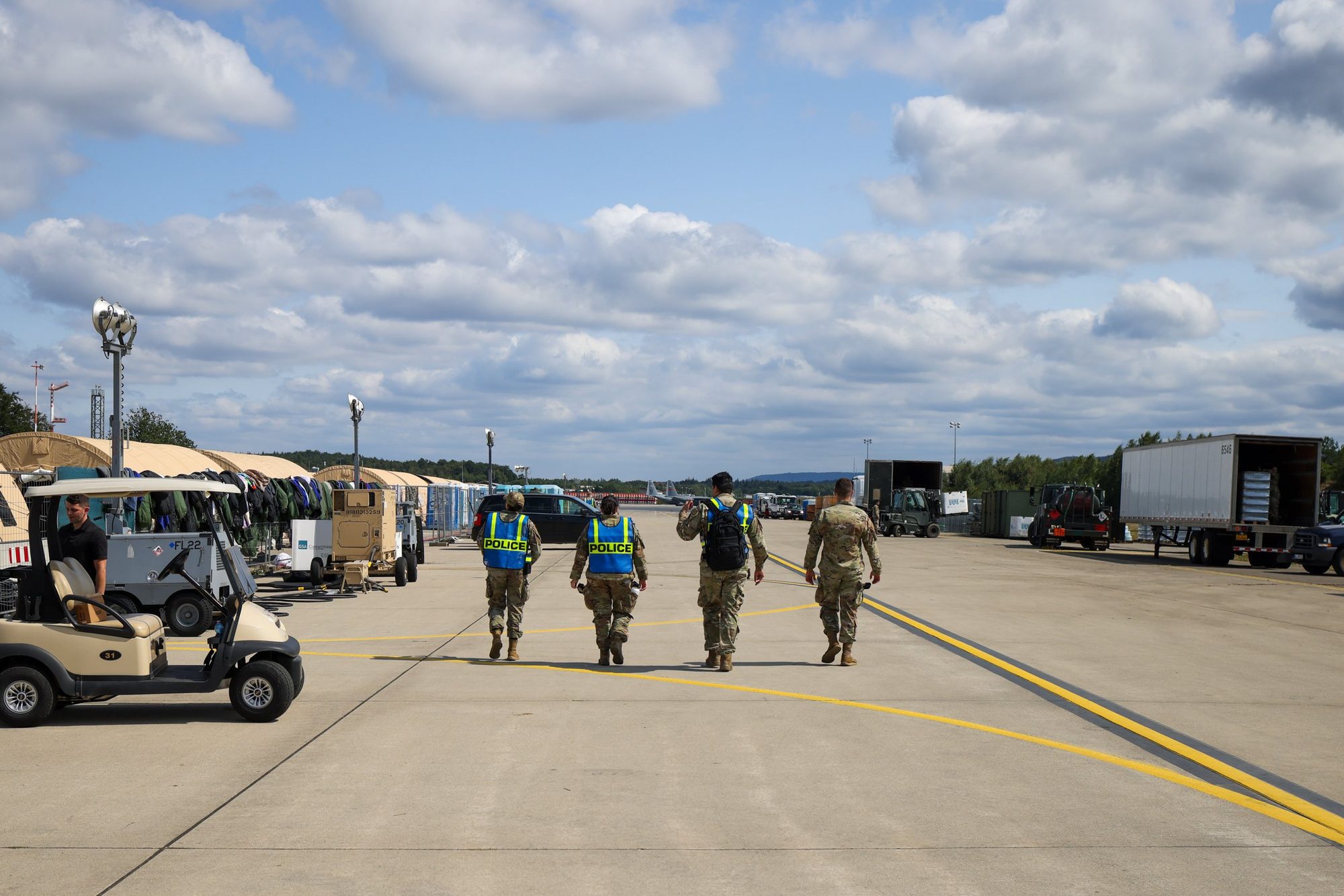 US military police patrol the tarmac at Ramstein Air Base during the Afghanistan evacuation operation, 2021