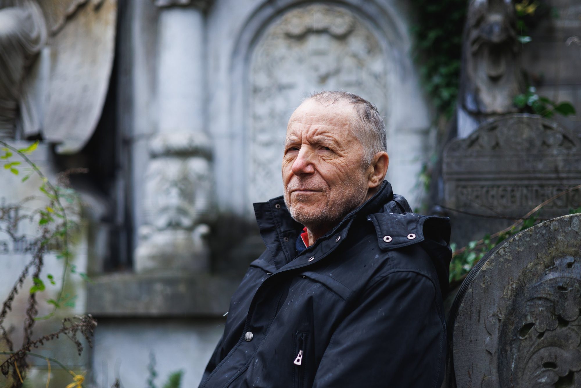 Guntram Weber, born into the Nazi Lebensborn programme, at a cemetery in Berlin, 2021