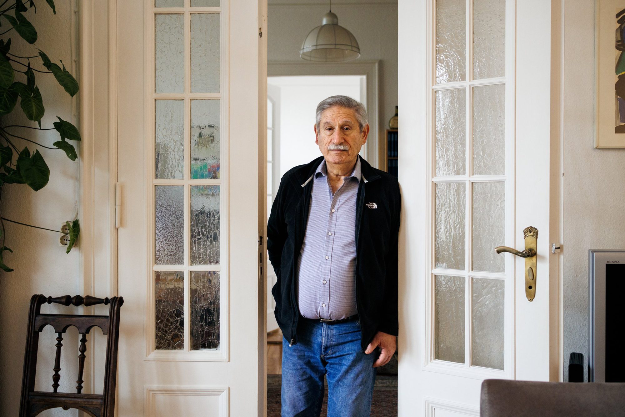 Ralph Ghadban, who spent years under police protection following death threats, at his home in Berlin, 2022